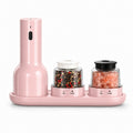 Pink salt and pepper shaker set on a white background