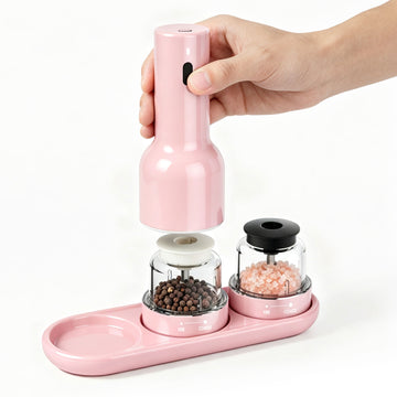 Pink pepper grinder with two compartments on a white background